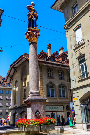 Bern, Switzerland - June 18, 2022: Anna Seiler fountain (Anna-Seiler-Brunnen) and Kafigturm tower in...