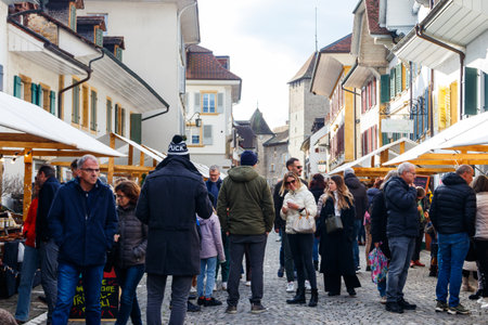 Murten, Switzerland - November 19, 2022: Vendors and buyers at street market in Murten, Switzerlandのeditorial素材
