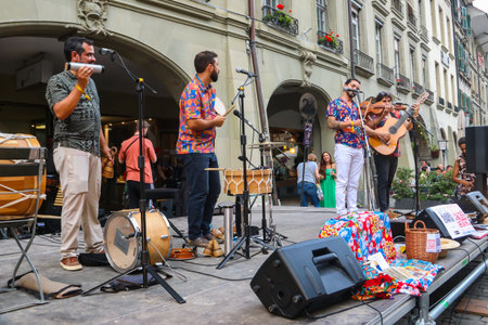 Bern, Switzerland - August 10, 2023: People performing at Buskers Bern Street Music Festival,...