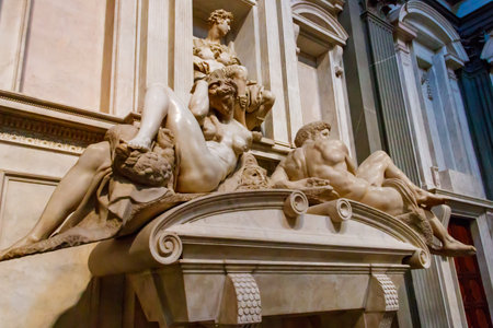 Florence, Italy - November 7, 2022: Tomb of Giuliano di Lorenzo de' Medici with Night and Day sculptures by Michelangelo, Medici tomb in the new sacristy of the Medici chapel in Florence, Italyのeditorial素材