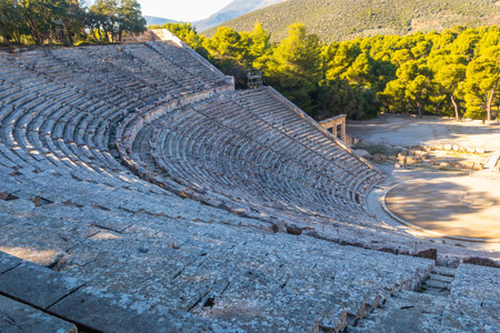 Ancient Theater of Epidaurus is theater in Greek city of Epidaurus, located on southeast end of sanctuary dedicated to the ancient Greek God of medicine, Asclepius in Peloponnese, Greeceの写真素材