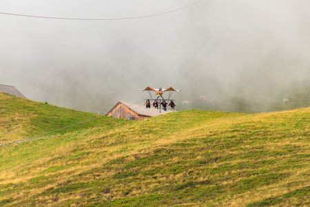 Grindelwald, Switzerland - August 6, 2022: Grindelwald First peak activity - First Glider, Switzerland. Flying with a bird of prey, tourist attractionのeditorial素材