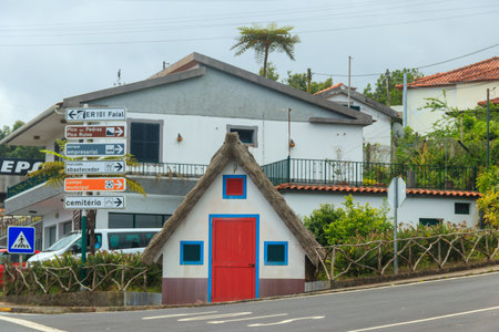 Santana, Portugal - June 19, 2024: Traditional rural house with straw roof in Santana village, Madeira island, Portugalのeditorial素材