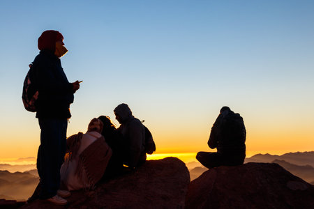South Sinai, Egypt - January 29, 2022: People watching sunrise on the summit of Mount Sinai (Moses Mount) in Egyptのeditorial素材