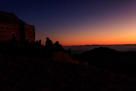South Sinai, Egypt - January 29, 2022: People watching sunrise on the summit of Mount Sinai (Moses Mount) in Egyptのeditorial素材