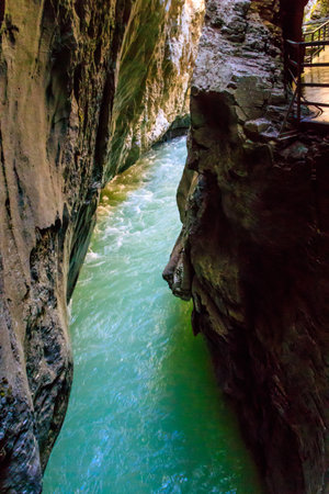 The Aare Gorge (German: Aareschlucht) is a section of the river Aare that carves through a limestone ridge near the town of Meiringen, in the Bernese Oberland region of Switzerlandの写真素材