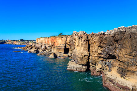 Boca do Inferno is a unique rock formation on the edge of the ocean in Cascais, Portugalの写真素材