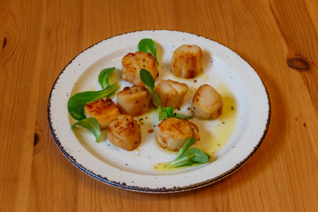 Delicious fried scallops on a tableの写真素材