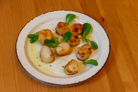 Delicious fried scallops on a tableの写真素材