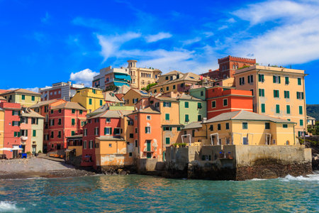 Picturesque view of beach, blue sea and colorful buildings of Boccadasse, old fishing village, in Genoa, Italyの写真素材