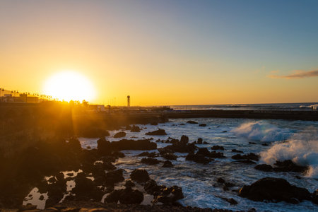 Sunset over Atlantic ocean in Puerto de la Cruz, Tenerife, Canary Islands, Spainの写真素材