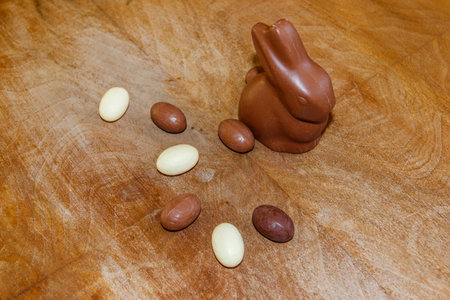 Easter chocolate bunny and chocolate eggs on wooden backgroundの写真素材