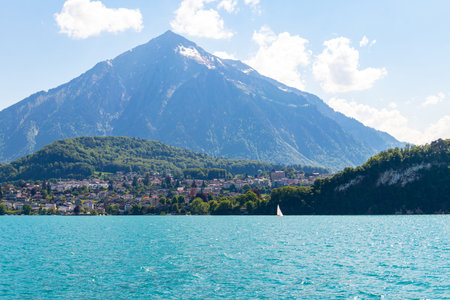 View of the Lake Thun and Niesen mountain (so called Swiss Pyramid) in Switzerlandの写真素材