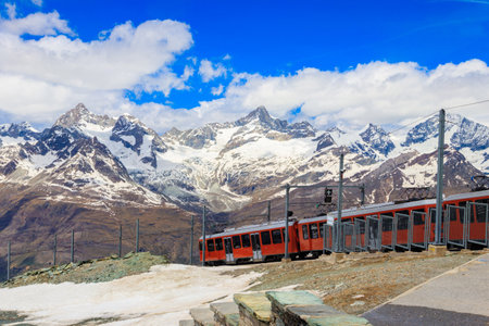 Beautiful view of the Swiss Alps with cogwheel train of Gornergrat railway close to Zermatt, Switzerlandの写真素材