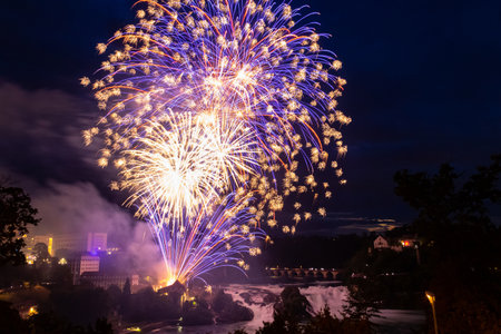 Fantastic fireworks at the Rhine Falls during the Swiss National Day celebrations on August 1 in Neuhausen am Rheinfall, Schaffhausen canton, Switzerlandの写真素材