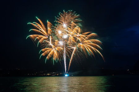 Fantastic fireworks at the Lake Thun during the Swiss National Day celebrations on August 1 in Gunten, Bern canton, Switzerlandの写真素材