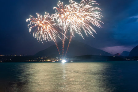 Fantastic fireworks at the Lake Thun during the Swiss National Day celebrations on August 1 in Gunten, Bern canton, Switzerlandの写真素材