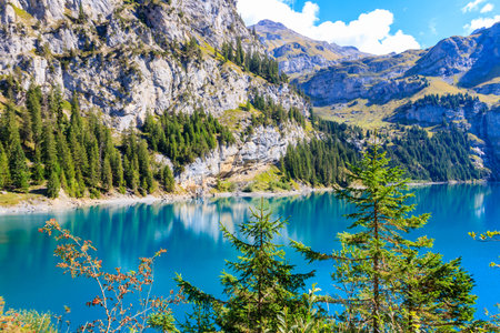 View of Oeschinen lake (Oeschinensee) and Swiss Alps near Kandersteg in Bernese Oberland, Switzerlandの写真素材