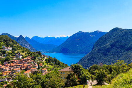 Scenic view of lake Lugano from Monte Bre mountain in Ticino canton, Switzerlandの写真素材