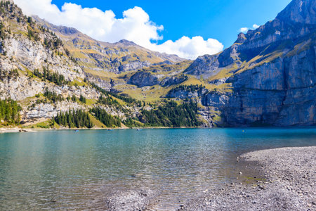 View of Oeschinen lake (Oeschinensee) and Swiss Alps near Kandersteg in Bernese Oberland, Switzerlandの写真素材