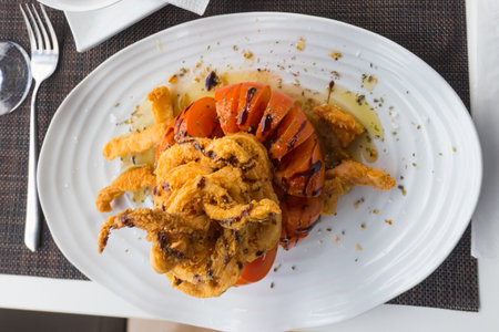 Crispy delicious fried squids served in a local restaurant in coastal village on Tenerife, Canary Islands, Spainの写真素材