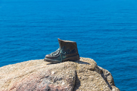 The boot of Cape Finisterre in Galicia, Spain. The bronze boot marks the end of Saint James Way