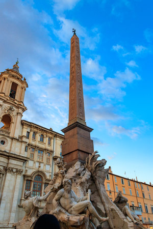 Fountain of the Four Rivers with an Egyptian obelisk at Piazza Navona in Rome, Italyの写真素材