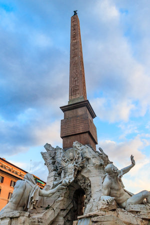 Fountain of the Four Rivers with an Egyptian obelisk at Piazza Navona in Rome, Italyの写真素材