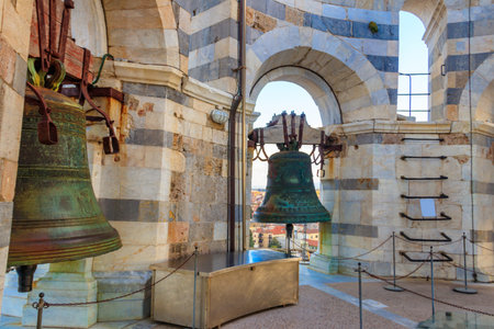 Bell at the top of the Leaning tower in Pisa, Italyの写真素材