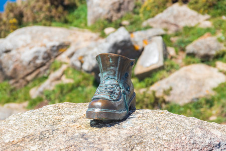 The boot of Cape Finisterre in Galicia, Spain. The bronze boot marks the end of Saint James Way