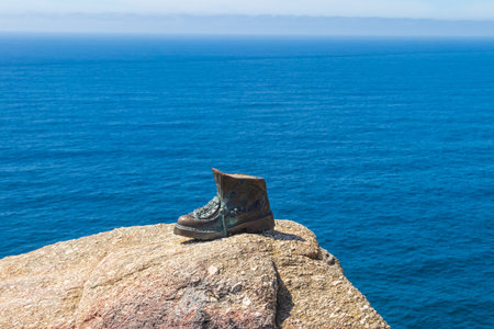 The boot of Cape Finisterre in Galicia, Spain. The bronze boot marks the end of Saint James Way