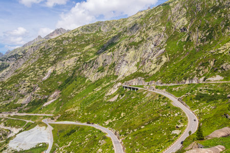 Scenic view of Grimsel Pass winding through the majestic mountains of Switzerland
