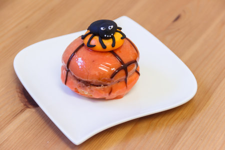 Creative Halloween cake on wooden tableの写真素材