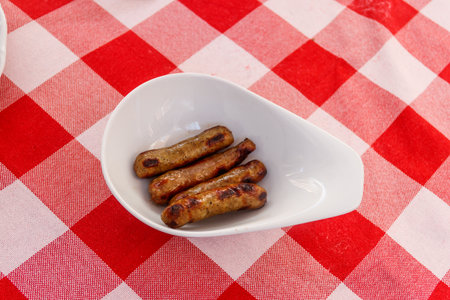 Grilled bavarian sausages on a tableの写真素材