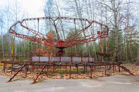 Old rusty carousel in amusement park of ghost town Pripyat in Chernobyl Exclusion Zone, Ukraineの写真素材