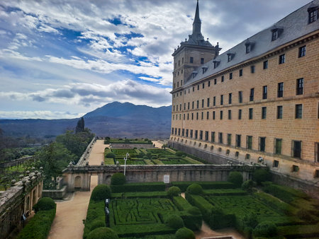 Beautiful El Escorial, or Royal Site of San Lorenzo de El Escorial, or Monasterio de El Escorial with gardenの写真素材