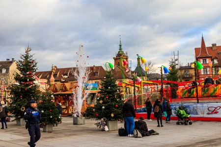 Colmar, France - December 6, 2023: People walking in old town of Colmar with traditional colorful half-timbered houses, decorated for Christmas time in Alsace, Franceのeditorial素材