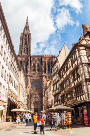 Strasbourg, France - August 23, 2025: Street view looking at the Notre-Dame de Strasbourg Cathedral, Franceのeditorial素材