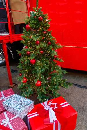 Festive decorated Christmas tree with gift boxesの写真素材