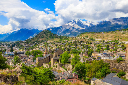 Panoramic view from a hill over City of Sion with and Swiss Alps in Canton Valais, Switzerlandの写真素材