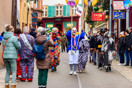 Basel, Switzerland - February 28, 2023: Carnival participants in costumes during the annual traditional carnival parade in Basel, Switzerlandのeditorial素材