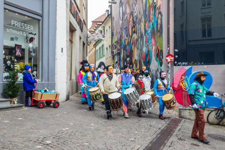 Basel, Switzerland - February 28, 2023: Carnival participants in costumes during the annual traditional carnival parade in Basel, Switzerlandのeditorial素材