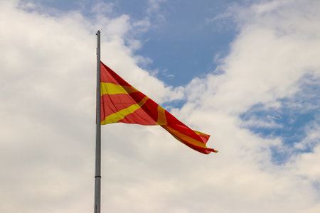 Flag of North Macedonia against blue skyの写真素材