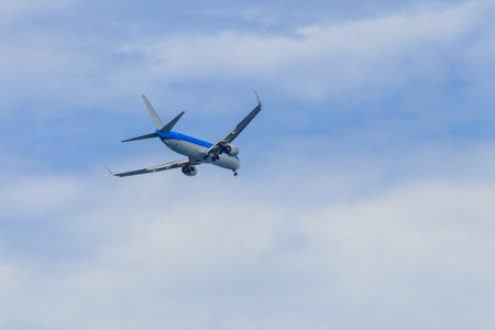 Passenger airplane flying in the blue sky