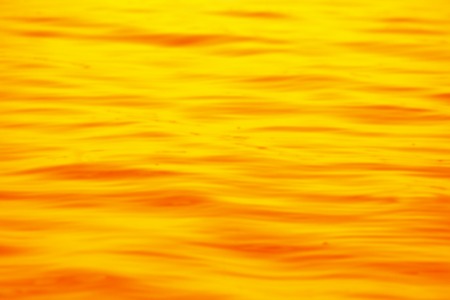 orange blur background reminding wavesの写真素材