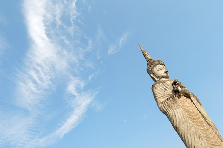 February 21, 2015: Buddha on background of blue sky in Buddha Park Sala Kaeo Kou near Nong Khai, Thailandのeditorial素材