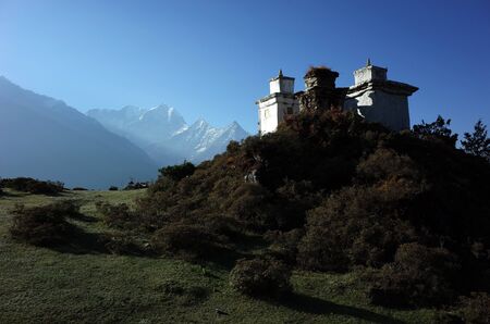 Buddhist stupas in Himalaya mountains in morning light, Sagarmatha national park, Khumbu valley, Nepalの写真素材