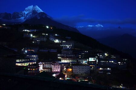 Night view of Namche Bazaar village and Thamserku mountain, Sagarmatha national park, Khumbu valley, Himalayas, Nepalの写真素材