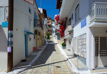 Pythagorion, Samos island, Greece - 14 May, 2018: Street view with traditional white houses in sunny dayのeditorial素材