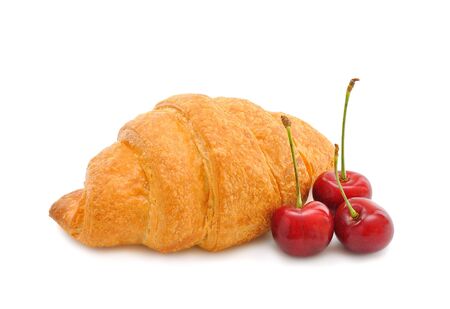 	Croissant with a cherry on a white backgroundの写真素材